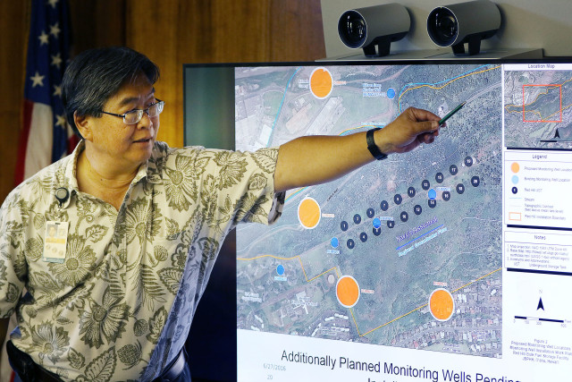 Board of Water Supply Ernie Lau demonstrates layout of Red Hill facility